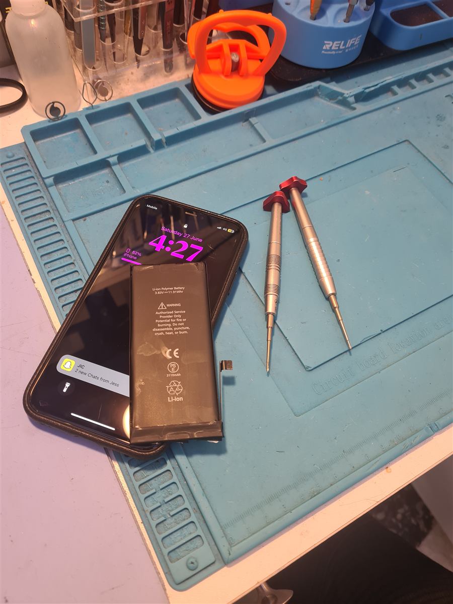 iPhone 11 open on the CCFix bench during a battery replacement