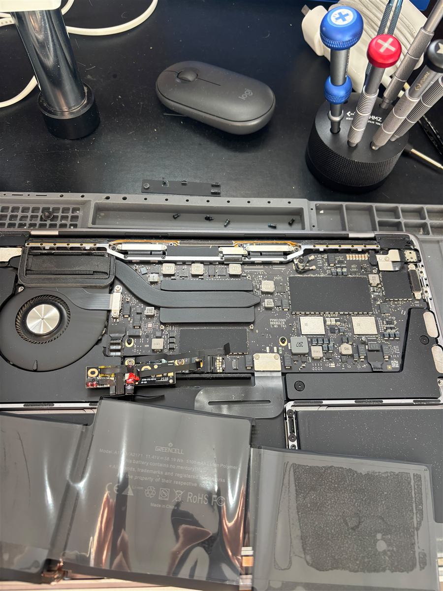 New battery being fitted to a 13-inch MacBook Pro on the CCFix bench